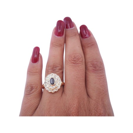 BAGUE FLEUR EN OR 18K, SAPHIR ET DIAMANTS.