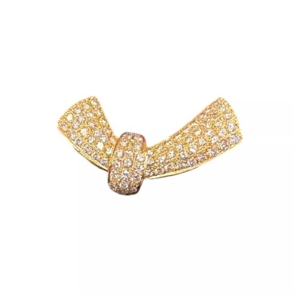 BROCHE EN FORME DE NŒUD DIAMANTS EN OR 18K