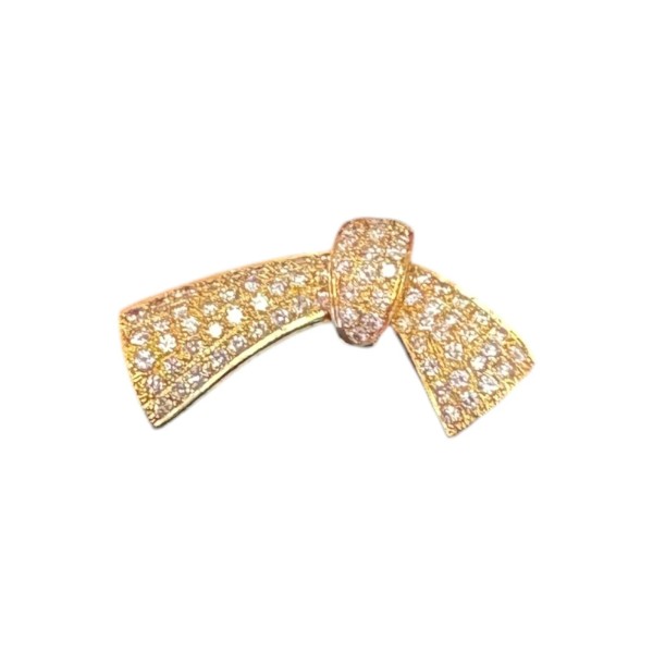 BROCHE EN FORME DE NŒUD DIAMANTS EN OR 18K